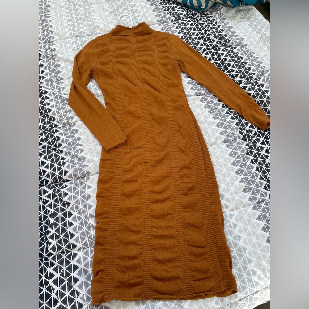 Beautiful Brown Dress . Fits really nice for curvy women . Wore twice